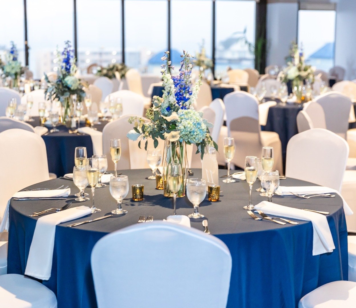 wedding seating in event room overlooking bay
